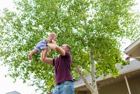 Dad Playing Outdoors with Toddler Child