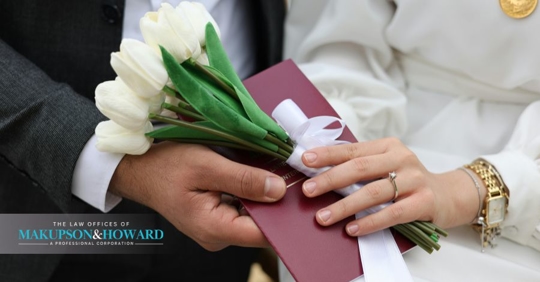 close up shot of married couple holding hands